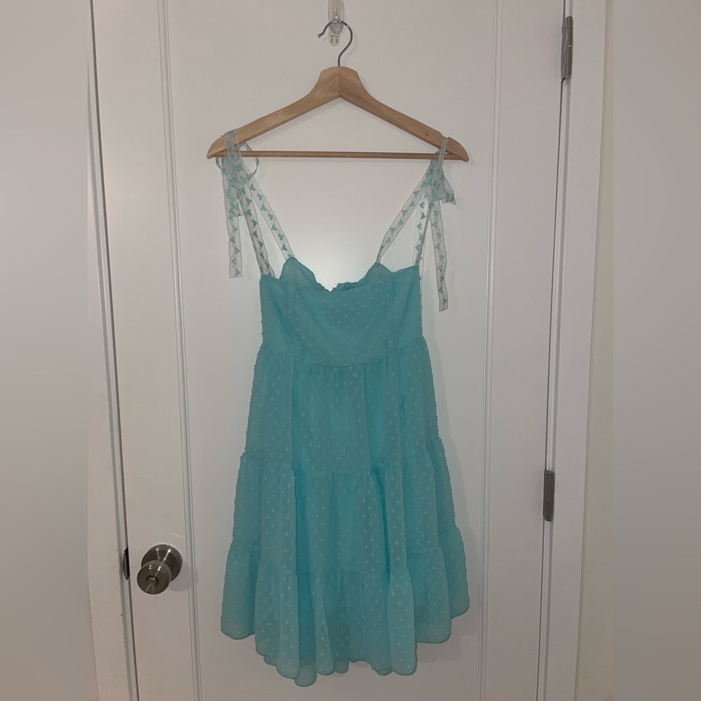 Lucy in the Sky brand new babydoll dress with adjustable straps and tie back.